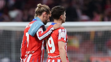 Atletico Madrid's French forward #07 Antoine Griezmann and Atletico Madrid's Argentine forward #19 Julian Alvarez react at the end of the Spanish Copa del Rey (King's Cup) semi-final second leg football match between Club Atletico de Madrid and FC Barcelona at Metropolitano Stadium in Madrid on April 2, 2025. (Photo by Thomas COEX / AFP)