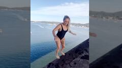 An Australian diver backflips off a 15-meter bridge and miscalculates, but emerges worried only about cutting herself on the way out.