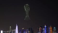 A drone show depicting the World Cup trophy is seen above the Doha skyline, ahead of the FIFA World Cup 2022 soccer tournament in Doha, Qatar November 14, 2022. REUTERS/Amr Abdallah Dalsh