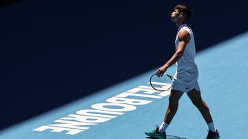 Spain�s Carlos Alcaraz reacts during a practice session on John Cain Arena in Melbourne on January 11, 2024 ahead of the Australian Open tennis championship starting on January 14. (Photo by DAVID GRAY / AFP) / -- IMAGE RESTRICTED TO EDITORIAL USE - STRICTLY NO COMMERCIAL USE --