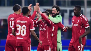 Liverpool players celebrate after winning the UEFA Champions League phase day 6 football match between Inter Milan and Liverpool at San Siro stadium in Milan, on December 9, 2025. (Photo by Stefano RELLANDINI / AFP)