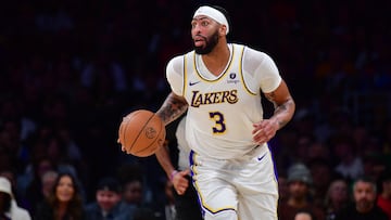 Dec 25, 2023; Los Angeles, California, USA; Los Angeles Lakers forward Anthony Davis (3) moves the ball up court against the Boston Celtics during the first half at Crypto.com Arena. Mandatory Credit: Gary A. Vasquez-USA TODAY Sports