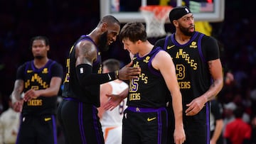 Dec 5, 2023; Los Angeles, California, USA; Los Angeles Lakers guard Austin Reaves (15) reacts after scoring three point basket against the Phoenix Suns with forward LeBron James (23) and forward Anthony Davis (3) during the second half of the In Season Tournament quarterfinal at Crypto.com Arena. Mandatory Credit: Gary A. Vasquez-USA TODAY Sports