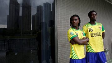 Solomon Nyassi (L), 26, from Gambia, a member of All Black FC, waits before joining a local team for a friendly match in Hong Kong, China, May 21, 2017. The team, All Black FC, is the first of its kind in the former British colony and offers a rare opportunity for refugees from more than 10 mostly African countries to integrate with residents. REUTERS/Bobby Yip             SEARCH &quot;HONG KONG SOCCER&quot; FOR THIS STORY. SEARCH &quot;WIDER IMAGE&quot; FOR ALL STORIES.  TPX IMAGES OF THE DAY
