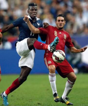 Pogba y Koke, de España.