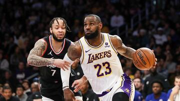 LOS ANGELES, CALIFORNIA - JANUARY 07: LeBron James #23 of the Los Angeles Lakers drives to the basket against Amir Coffey #7 of the Los Angeles Clippers in the second quarter at Crypto.com Arena on January 07, 2024 in Los Angeles, California. NOTE TO USER: User expressly acknowledges and agrees that, by downloading and or using this photograph, User is consenting to the terms and conditions of the Getty Images License Agreement.   Meg Oliphant/Getty Images/AFP (Photo by Meg Oliphant / GETTY IMAGES NORTH AMERICA / Getty Images via AFP)