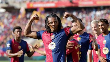 Barcelona's Jules Kounde celebrates scoring his side's 3rd goal during the Spanish La Liga soccer match between FC Barcelona and Valladolid at the Olympic stadium in Barcelona, Spain, Saturday, Aug. 31, 2024. (AP Photo/Joan Monfort)