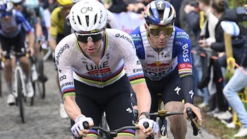 UAE Team Emirates' Slovenian rider Tadej Pogacar and Red Bull-BORA-hansgrohe's Belgian rider Remco Evenepoel cycle in the men's race of the 'Ronde van Vlaanderen/ Tour des Flandres/ Tour of Flanders' UCI WorldTour one day cycling race, 278 km from Antwerp to Oudenaarde, in Haaltert on April 5, 2026. (Photo by Nico VEREECKEN / Belga / AFP) / Belgium OUT