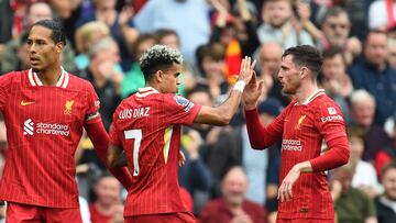 Soccer Football - Premier League - Liverpool v AFC Bournemouth - Anfield, Liverpool, Britain - September 21, 2024 Liverpool's Luis Diaz celebrates scoring their first goal with Andrew Robertson REUTERS/Peter Powell EDITORIAL USE ONLY. NO USE WITH UNAUTHORIZED AUDIO, VIDEO, DATA, FIXTURE LISTS, CLUB/LEAGUE LOGOS OR 'LIVE' SERVICES. ONLINE IN-MATCH USE LIMITED TO 120 IMAGES, NO VIDEO EMULATION. NO USE IN BETTING, GAMES OR SINGLE CLUB/LEAGUE/PLAYER PUBLICATIONS. PLEASE CONTACT YOUR ACCOUNT REPRESENTATIVE FOR FURTHER DETAILS..
