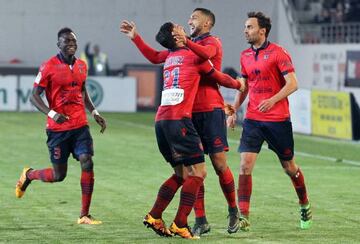 Ajaccio's Mohamed Larbi (second right) is congratulated by his team-mates after grabbing the hosts' equaliser in Wednesday's 1-1 draw with Marseille.