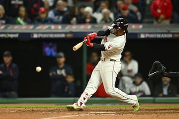 Oct 18, 2024; Cleveland, Ohio, USA; Cleveland Guardians third baseman Jose Ramirez (11) hits an RBI double in the seventh inning against the New York Yankees during game four of the ALCS for the 2024 MLB playoffs at Progressive Field. Mandatory Credit: Ken Blaze-Imagn Images