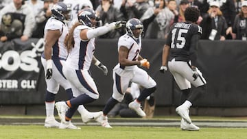 Nov 26, 2017; Oakland, CA, USA; Oakland Raiders wide receiver Michael Crabtree (15) taunts Denver Broncos cornerback Aqib Talib (21) after the incident on the sidelines during the first quarter at Oakland Coliseum. Mandatory Credit: Neville E. Guard-USA TODAY Sports