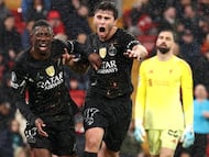 Paris Saint-Germain's French forward #10 Ousmane Dembele (L) celebrates scoring his team's second goal with Paris Saint-Germain's Portuguese midfielder #87 Joao Neves during the UEFA Champions League quarter final, second-leg football match between Liverpool and Paris Saint-Germain at Anfield in Liverpool, north west England on April 14, 2026. (Photo by FRANCK FIFE / AFP)