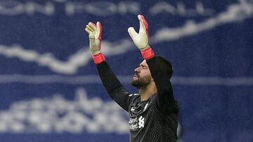 WEST BROMWICH, ENGLAND - MAY 16: Roberto Firmino of Liverpool leads his team on to the pitch in front of team mate Alisson (R) prior to the Premier League match between West Bromwich Albion and Liverpool at The Hawthorns on May 16, 2021 in West Bromwich,