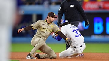 Apr 13, 2024; Los Angeles, California, USA; Los Angeles Dodgers center fielder James Outman (33) steals second against San Diego Padres second baseman Tyler Wade (14) during the fourth inning at Dodger Stadium. Mandatory Credit: Gary A. Vasquez-USA TODAY Sports