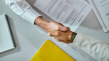 Close-up of businessmen shaking hands after successful agreement.