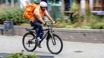 Former Afghan Communication Minister Sayed Sadaat works as a bicycle rider for the food delivery service Lieferando in Leipzig, Germany, August 26, 2021. REUTERS/Hannibal Hanschke