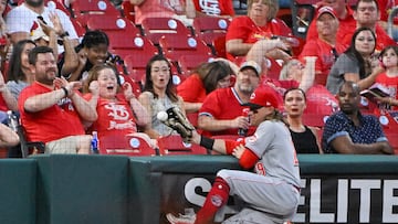 Cincinnati Reds left fielder TJ Friedl (29) slams into the side wall and cannot catch a foul ball