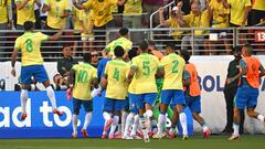 Brazil's forward #11 Raphinha (hidden) celebrates scoring his team's first goal with teammates during the Conmebol 2024 Copa America tournament group D football match between Brazil and Colombia at Levi's Stadium in Santa Clara, California on July 2, 2024. (Photo by Patrick T. Fallon / AFP)