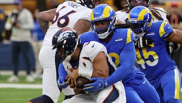 INGLEWOOD, CALIFORNIA - DECEMBER 25: Larrell Murchison #52 of the Los Angeles Rams sacks Russell Wilson #3 of the Denver Broncos during the first quarter of the game at SoFi Stadium on December 25, 2022 in Inglewood, California. Katelyn Mulcahy/Getty Images/AFP (Photo by Katelyn Mulcahy / GETTY IMAGES NORTH AMERICA / Getty Images via AFP)