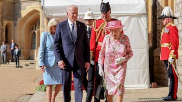 U.S. President Joe Biden and Britain&#039;s Queen Elizabeth walk ahead of U.S. first lady Jill Biden, at Windsor Castle in Windsor, Britain, June 13, 2021. Chris Jackson/Pool via REUTERS