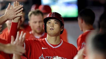 Aug 25, 2023; New York City, New York, USA; Los Angeles Angels designated hitter Shohei Ohtani (17) high fives teammates in the dugout after scoring on a single by third baseman Mike Moustakas (not pictured) during the third inning Los Angeles Angels manager Phil Nevin (88) at Citi Field. Mandatory Credit: Brad Penner-USA TODAY Sports