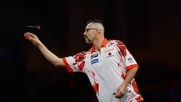 Darts - 2025 PDC World Darts Championship - Alexandra Palace, London, Britain - December 21, 2024 Damon Heta in action during his second round match against Connor Scutt Action Images via Reuters/Peter Cziborra