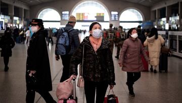 Passengers arrive at Hankou railway station on the first day of peak travel ahead of the Lunar New Year of the Tiger in Wuhan in China's central Hubei province on January 17, 2022. (Photo by AFP) / China OUT