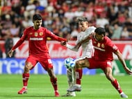 Diego Barbosa (L) of Toluca, Cristian Calderon (C) of Necaxa and Andres Pereisa (R) of Toluca during the 10th round match between Necaxa and Toluca as part of the Liga BBVA MX Varonil, Torneo Clausura 2026 at Victoria Stadium, on February 21, 2026 in Aguascalientes, Mexico.