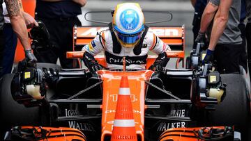 McLaren's Spanish driver Fernando Alonso steps out of his car after the third practice session for the Formula One Chinese Grand Prix in Shanghai on April 8, 2017. / AFP PHOTO / Johannes EISELE
