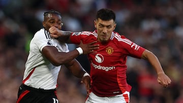 Fulham's Spanish midfielder #11 Adama Traore (L) vies with Manchester United's Argentinian defender #06 Lisandro Martinez (R) during the English Premier League football match between Manchester United and Fulham at Old Trafford in Manchester, north west England, on August 16, 2024. (Photo by Darren Staples / AFP) / RESTRICTED TO EDITORIAL USE. No use with unauthorized audio, video, data, fixture lists, club/league logos or 'live' services. Online in-match use limited to 120 images. An additional 40 images may be used in extra time. No video emulation. Social media in-match use limited to 120 images. An additional 40 images may be used in extra time. No use in betting publications, games or single club/league/player publications. /