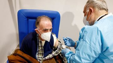 FILE PHOTO: An elderly man receives a dose of the Moderna vaccine against the coronavirus disease (COVID-19) at the Music Auditorium in Rome, Italy, February 15, 2021. REUTERS/Guglielmo Mangiapane/File Photo