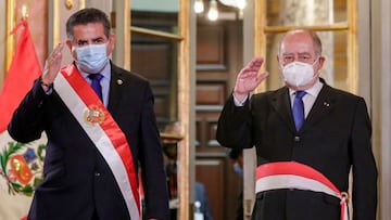 Handout picture distributed by the Peruvian Presidency press of Perux92s interim President Manuel Merino (L) and conservative politician Antero Flores-Araoz waving during the swearing in ceremony of the latter as Chief of Staff on November 11, 2020. - President Manuel Merino, former head of Congress, received the presidential sash Wednesday after president MartxEDn Vizcarra was removed from office on charges of corruption. (Photo by - / PRESIDENCIA DEL PERU / AFP) / RESTRICTED TO EDITORIAL USE - MANDATORY CREDIT AFP PHOTO / PERUVIAN PRESIDENCY - NO MARKETING NO ADVERTISING CAMPAIGNS -DISTRIBUTED AS A SERVICE TO CLIENTS