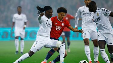 Soccer Football - Champions League - Lille v Real Madrid - Decathlon Arena Stade Pierre-Mauroy, Lille, France - October 2, 2024 Real Madrid's Eduardo Camavinga in action with Lille's Tiago Santos REUTERS/Stephanie Lecocq