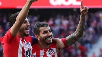 Atletico Madrid's Argentinian forward #10 Angel Correa (R) celebrates scoring his team's fourth goal, with Atletico Madrid's Spanish midfielder #06 Koke, during the Spanish league football match between Club Atletico de Madrid and UD Las Palmas at the Metropolitano stadium in Madrid on February 17, 2024. (Photo by Pierre-Philippe MARCOU / AFP)