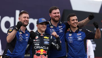 Red Bull Racing�s French driver Isack Hadjar (2nd L) celebrates with teammates on stage after qualifying for the Formula One Australian Grand Prix at Albert Park Circuit in Melbourne on March 7, 2026. (Photo by Martin KEEP / AFP) / -- IMAGE RESTRICTED TO EDITORIAL USE - STRICTLY NO COMMERCIAL USE --