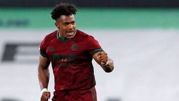 Wolverhampton Wanderers' Spanish midfielder Adama Traore celebrates after scoring their late winner during the English Premier League football match between Fulham and Wolverhampton Wanderers at Craven Cottage in London on April 9, 2021. - Wolves won