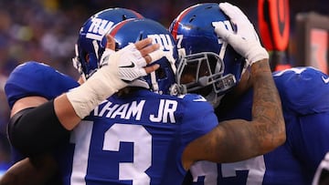 EAST RUTHERFORD, NJ - DECEMBER 18: Odell Beckham Jr. #13 of the New York Giants and teammates celebrate his touchdown against the Detroit Lions in the fourth quarter at MetLife Stadium on December 18, 2016 in East Rutherford, New Jersey.   Al Bello/Getty Images/AFP
 == FOR NEWSPAPERS, INTERNET, TELCOS &amp; TELEVISION USE ONLY ==