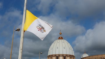 The Vatican flag flutters at half-mast at the Basilica of Our Lady of Peace, following the death of Pope Francis, in Yamoussoukro, Ivory Coast, April 22, 2025. REUTERS/Luc Gnago
