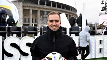 German former football player Philipp Lahm, also head of Germany's 2024 European Championship organizing committee, holds the official ball on November 15, 2023 at the Olympic Stadium in Berlin, Germany, during an event organised by sports equipment maker Adidas to present the official ball for the 2024 UEFA European Football Championship. (Photo by Tobias SCHWARZ / AFP)