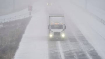 A transport truck drives along Highway 401 in London, Ontario, Canada, during a large winter storm on Friday, December 23, 2022. - Schools and some highways in the region were closed, and air travel was disrupted as the system made its way across the province. (Photo by Geoff Robins / AFP) (Photo by GEOFF ROBINS/AFP via Getty Images)