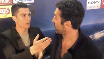 Cristiano stops to give Buffon a hug in the Mixed Zone