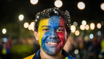 BOGOTA, COLOMBIA - JULY 14: A Colombian fan wearing face paint in the colors of the Colombian flag watches the CONMEBOL Copa America USA 2024 Final against Argentina broadcast in the Movistar Arena on July 14, 2024 in Bogota, Colombia. (Photo by Diego Cuevas/Getty Images)