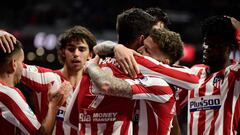 Atletico Madrid&#039;s Spanish forward Alvaro Morata is congratulated by teammates after scoring a goal during the Spanish League football match between Club Atletico de Madrid and CA Osasuna, at the Wanda Metropolitano stadium in Madrid on December 14, 2