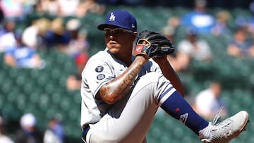 SEATTLE, WASHINGTON - APRIL 20: Julio Urias #7 of the Los Angeles Dodgers pitches during the first inning against the Seattle Mariners at T-Mobile Park on April 20, 2021 in Seattle, Washington. Abbie Parr/Getty Images/AFP == FOR NEWSPAPERS, INTERNET, TELCOS & TELEVISION USE ONLY ==