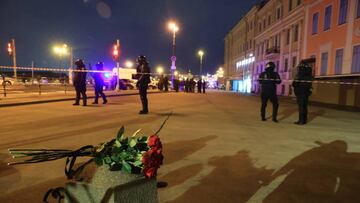 SAINT-PETERSBURG, RUSSIA - APRIL 02: People lay flowers as Russian forces take security measures at the explosion site in which prominent Russian military correspondent Vladlen Tatarsky died in Saint-Petersburg, Russia on April 02, 2023. According to the statement made by the Russian Interior Ministry, one person was killed and 16 person injured in an explosion in a cafe. (Photo by Stringer/Anadolu Agency via Getty Images)