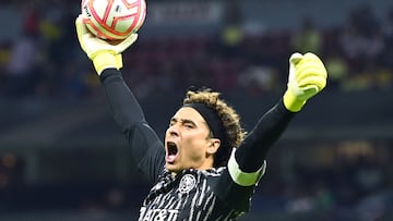 Guillermo Ochoa of America celebrates after his team defeat Guadalajara during their Mexican Apertura football tournament match at the Azteca stadium in Mexico City, on September 17, 2022. (Photo by RODRIGO ARANGUA / AFP)