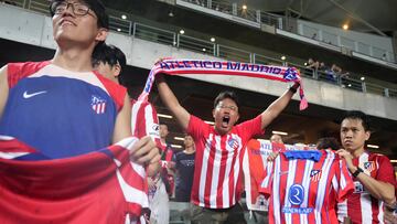Hong Kong (Hong Kong), 07/08/2024.- Spectators wave Atletico de Madrid t-shirts and scarfs before a friendly soccer match against the Kitchee of Hong Kong at the Hong Kong Stadium in Hong Kong, China, 07 August 2024. Atletico de Madrid won over Kitchee for 6 to 1. (Futbol, Amistoso) EFE/EPA/BERTHA WANG