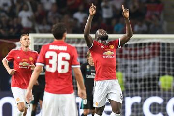 Romelu Lukaku points to the heavens after pulling one back for United in Skopje.