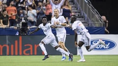 Vancouver Whitecaps&#039; Alphonso Davies, Brek Shea and Kei Kamara, from left, celebrate Davies&#039; second goal against Minnesota United during the second half of an MLS soccer match Saturday, July 28, 2018, in Vancouver, British Columbia. (Darryl Dyck/The Canadian Press via AP)